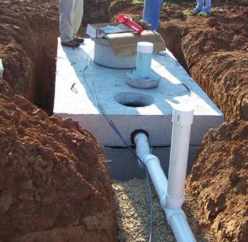 Installation of a 1,000-gallon concrete septic tank