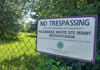 No trespassing signage on a chain-link fence surrounding the Greenfield Environmental Springfield Facility