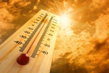 thermometer outside with sun displaying high temperatures
