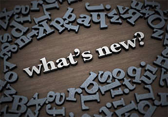 The phrase "What's New?" with various letters scattered around the phrase.