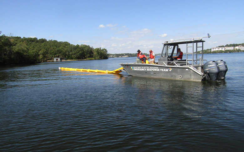 Environmental emergency response section practices boom deployment which is deployed on waterways to control petroleum spills.