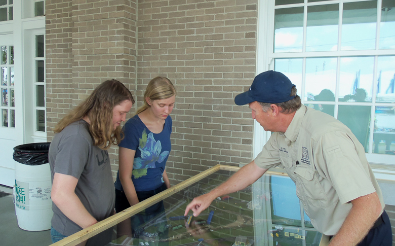 Environmental emergency response staff shows the Spillville display to visitors at the Missouri State Fair.