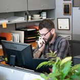 A department employee talking to an individual on the telephone