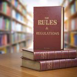 Laws, rules and regulations books sitting on a desk in a library