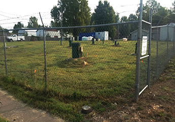 The fenced in property making up the Solid State Circuits Inc. site, from the corner of the property