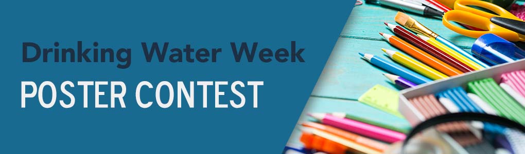 Art supplies laying on a desktop with the caption "Drinking Water Week Poster Contest"