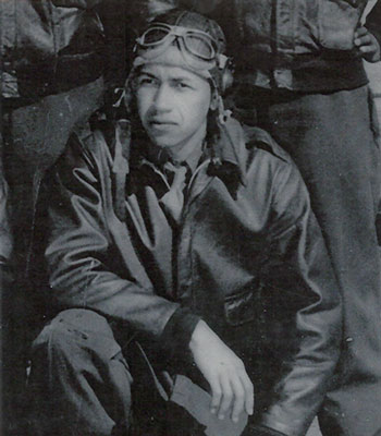 Airman dressed in pilot’s jacket and helmet with goggles.