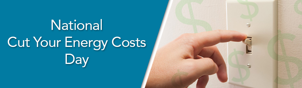 A persons hand turning off a light switch