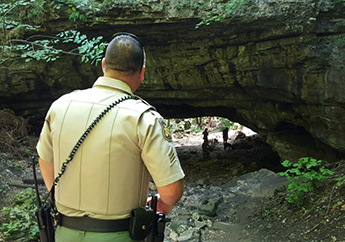 A park ranger checking on parks visitors for their safety