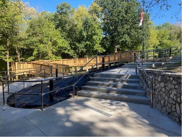 Stairs and ADA entrance with American flag on a flagpole at Mastodon State Historic Site