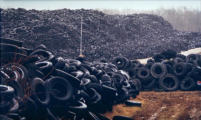 Surveyors measuring the tire piles at the RIM Tire Site