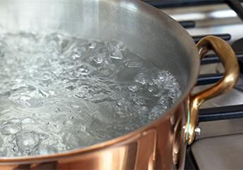 pan of boiling water on stove
