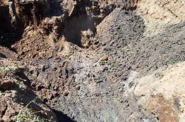 Soil contaminated by petroleum that leaked from an underground storage tank.