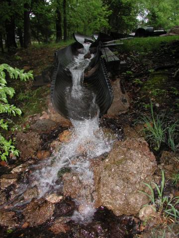 Water from the Mulberry Well pump being treated as it travels through plastic culverts and discharges to a nearby stream. 
