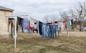 Picture of clothes hanging on outdoor clothesline.