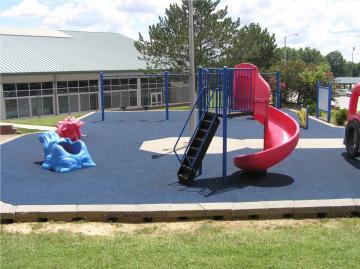 Pour in place playground surface made from recycled scrap tires in Perryville, Missouri, 2013