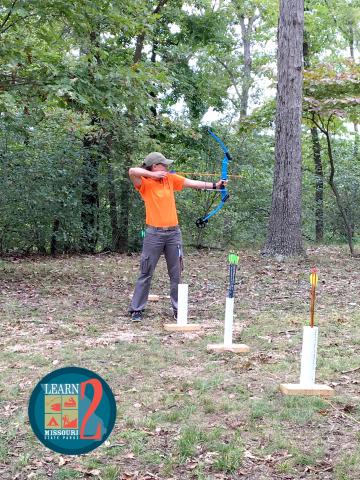 Individual learns archery skills in MoStateParks during Learn 2 series