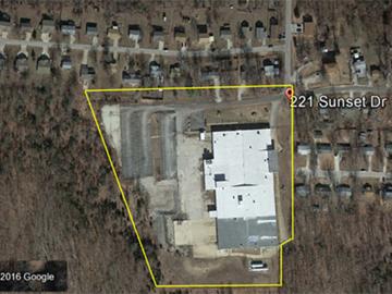 Aerial view of the 221 Sunset Drive facility with the site boundaries marked