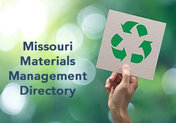 A hand holding a piece of paper with the recycling symbol and the words Missouri Materials Management Directory