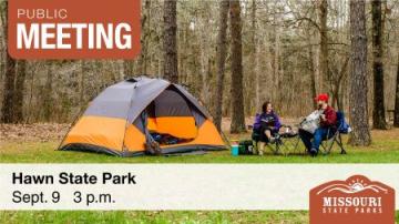 Man and woman sitting in camp chairs next to stripped tent relaxing at Hawn State Park