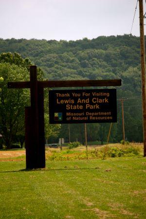 Brown cantilever sign that says “Thank you for visiting Lewis and Clark State Park. Missouri Department of Natural Resources”