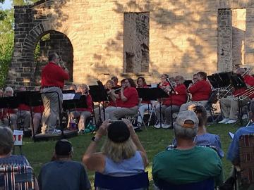 A band in red shirts playing music at Ha Ha Tonka State Park