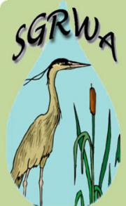Drawing of a bird looking to the right standing next to plants with the letters SGRWA at the top.