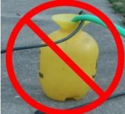 hand sprayer with the "no" symbol on it