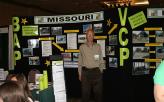 MoDNR employee Larry Baer in front of the BVCP exhibit at the 2015 Conference